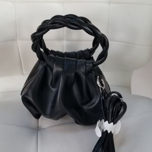 House of Want black Clutch